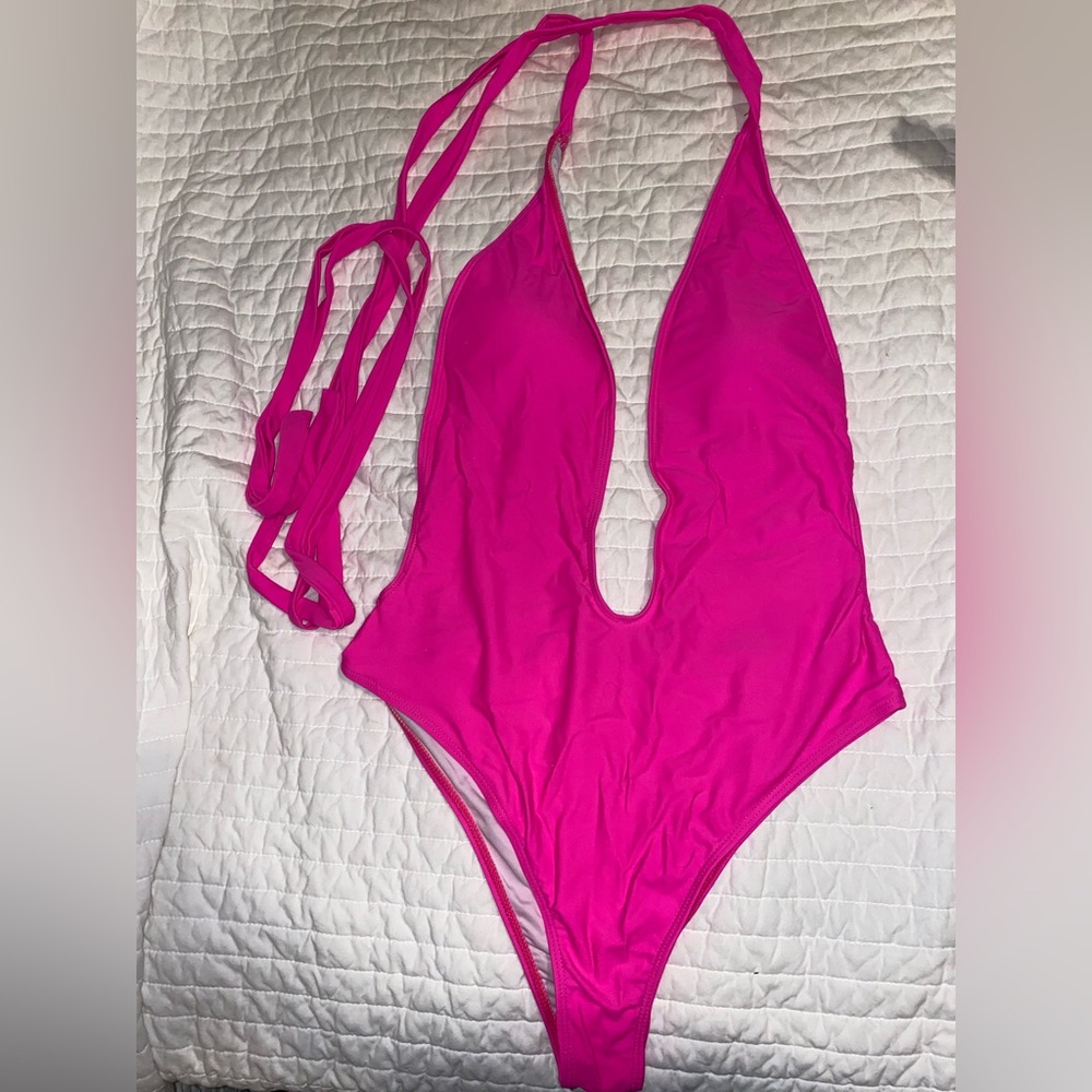 Pink one piece plunge neck, open back swimsuit